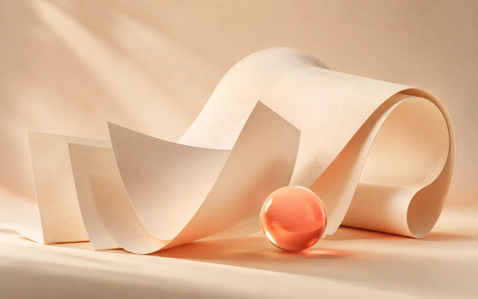 Lumo: unfolding ivory paper and a coral glass sphere